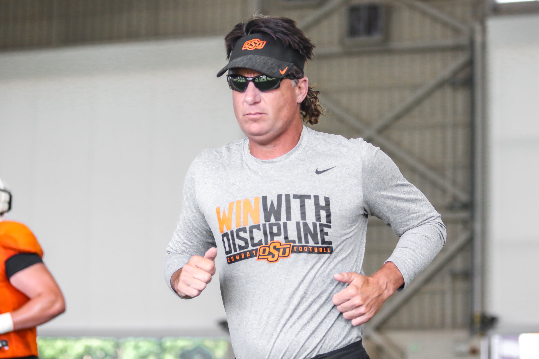 August 12: Football coach Mike Gundy